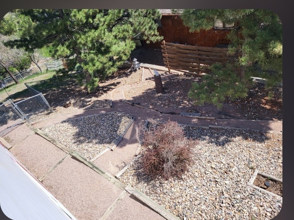 River rock bed installed and bordered in Rapid City, SD